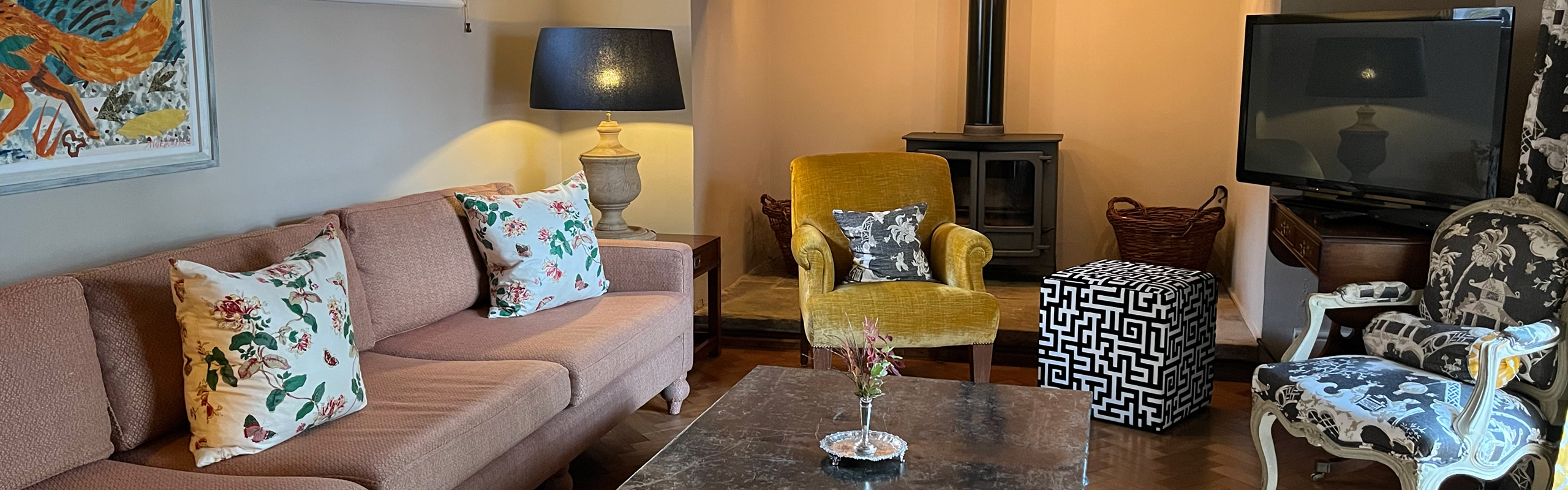 Wide-angle view of the sitting room of The Dene