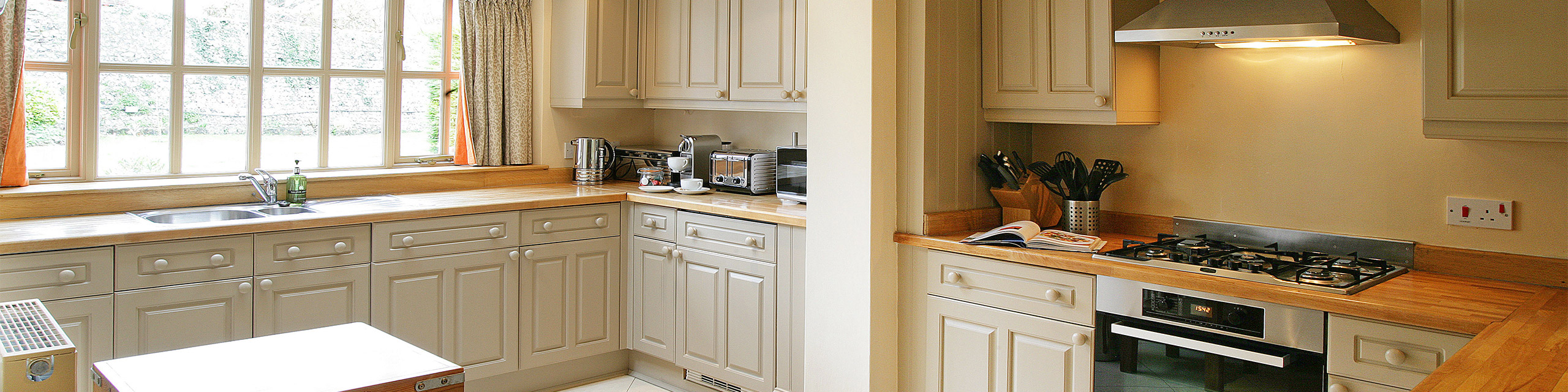 Wide-angle view of the kitchen at The Dene